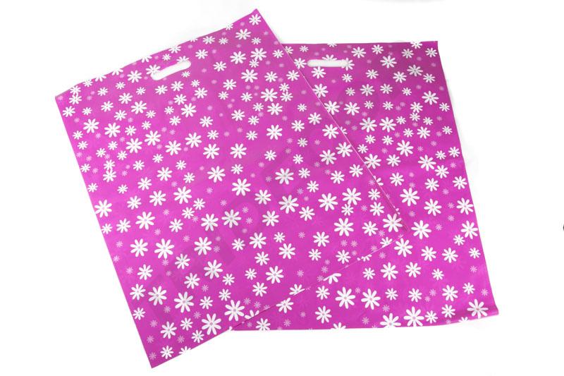 Bolsas de plástico con asas troqueladas 25X35cm Margaritas 50uds