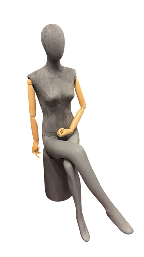 Female Mannequin Sitting Feet Crossed Gray Linen Arm Light