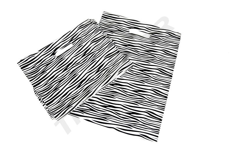 Sac en plastique avec poignée découpée et imprimé zèbre 35X45CM 100 unités